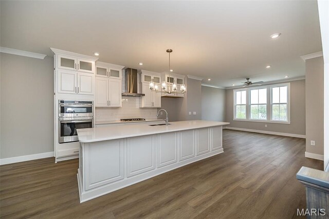 8915 E Gateway Hts Unit 94-803, Richmond Heights, MO 63144 - kitchen featuring wall chimney range hood, double oven, ornamental molding, gas cooktop, and dark wood-type flooring