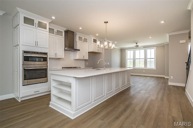 8915 E Gateway Hts Unit 94-803, Richmond Heights, MO 63144 - kitchen featuring open shelves, double oven, wall chimney range hood, light countertops, and dark wood finished floors