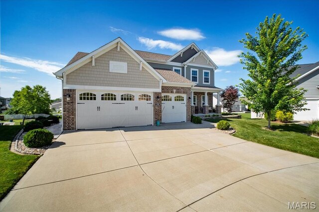 2385 Chemin Ave, Saint Charles, MO 63301 - craftsman inspired home with driveway, brick siding, and a front yard