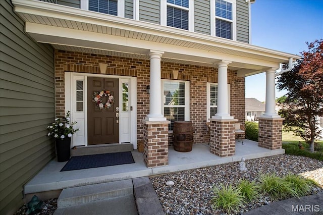 2385 Chemin Ave, Saint Charles, MO 63301 - view of exterior entry featuring covered porch and brick siding