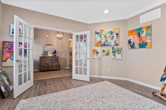 2385 Chemin Ave, Saint Charles, MO 63301 - recreation room featuring french doors, wood finished floors, ornamental molding, a chandelier, and recessed lighting