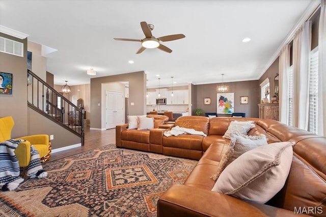 2385 Chemin Ave, Saint Charles, MO 63301 - living room featuring stairs, a chandelier, wood finished floors, a ceiling fan, and recessed lighting