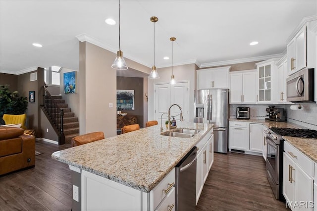 2385 Chemin Ave, Saint Charles, MO 63301 - kitchen featuring stainless steel appliances, glass insert cabinets, crown molding, white cabinetry, and dark wood-type flooring