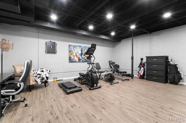 2385 Chemin Ave, Saint Charles, MO 63301 - workout room featuring wood finished floors and baseboards