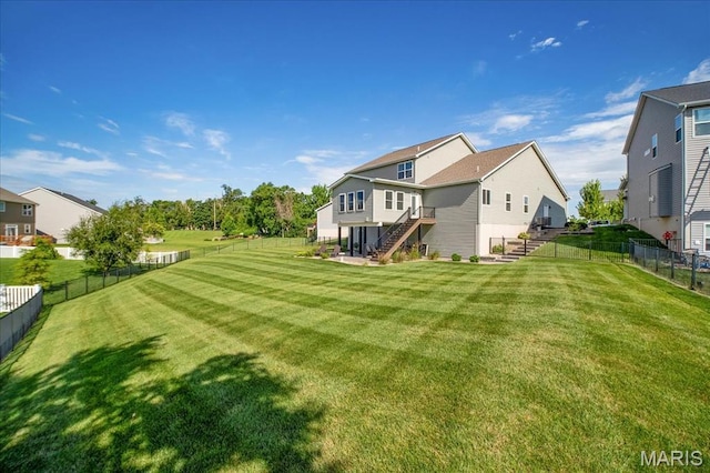 2385 Chemin Ave, Saint Charles, MO 63301 - back of house featuring stairs and a fenced backyard