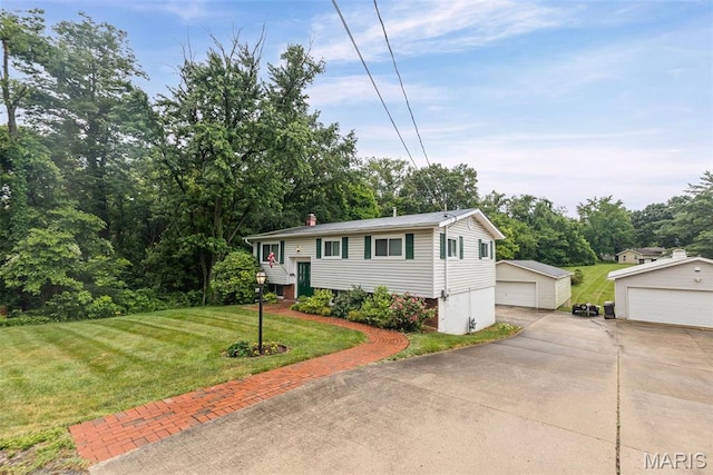 3200 Ridgeway Ave, Godfrey, IL 62035 - raised ranch featuring a garage, an outdoor structure, a front yard, and a chimney