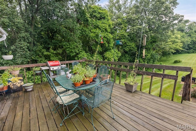 3200 Ridgeway Ave, Godfrey, IL 62035 - wooden deck featuring outdoor dining space, a grill, and a yard