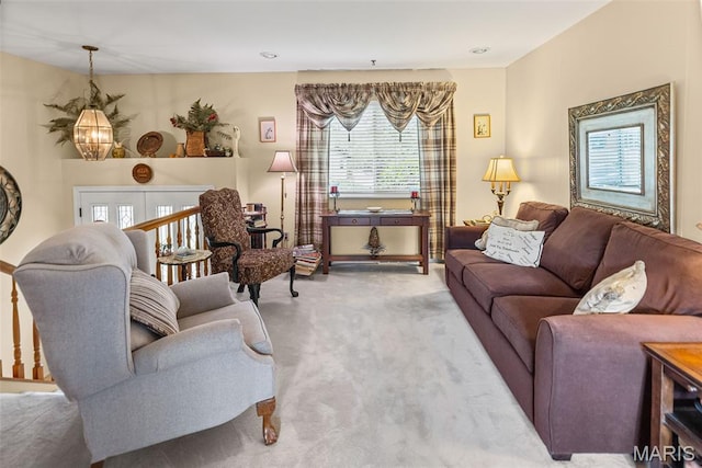 3200 Ridgeway Ave, Godfrey, IL 62035 - living area with healthy amount of natural light, carpet flooring, and a chandelier