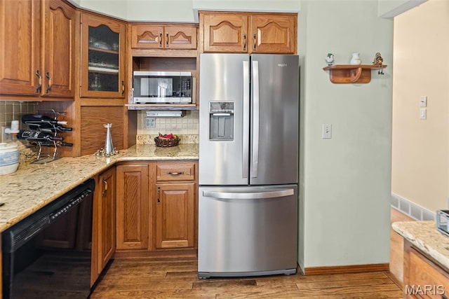 3200 Ridgeway Ave, Godfrey, IL 62035 - kitchen featuring appliances with stainless steel finishes, light stone counters, and backsplash