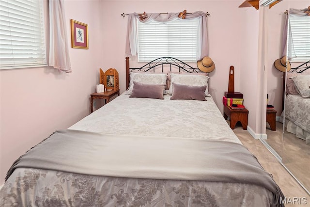 3200 Ridgeway Ave, Godfrey, IL 62035 - bedroom featuring multiple windows and light colored carpet