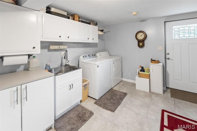 3200 Ridgeway Ave, Godfrey, IL 62035 - laundry room featuring independent washer and dryer, cabinet space, and light tile patterned floors