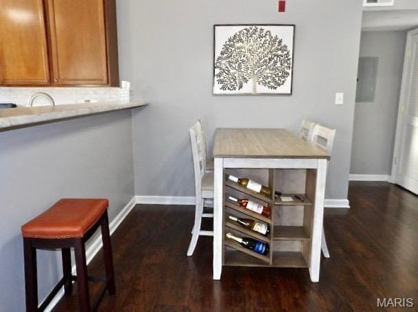 7302 Spring Creek Ln, Ofallon, MO 63368 - dining room featuring dark wood finished floors and baseboards