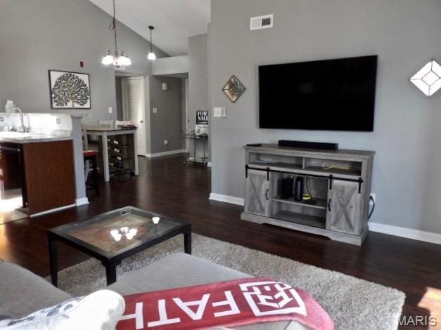 7302 Spring Creek Ln, Ofallon, MO 63368 - living area featuring wood finished floors and high vaulted ceiling