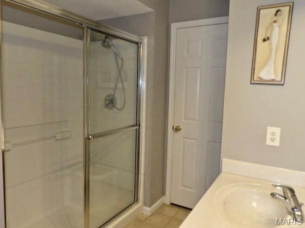 7302 Spring Creek Ln, Ofallon, MO 63368 - bathroom with a stall shower and tile patterned flooring