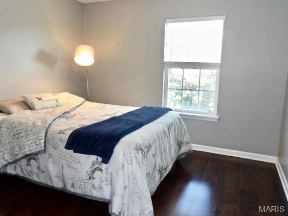 7302 Spring Creek Ln, Ofallon, MO 63368 - bedroom featuring baseboards and wood finished floors