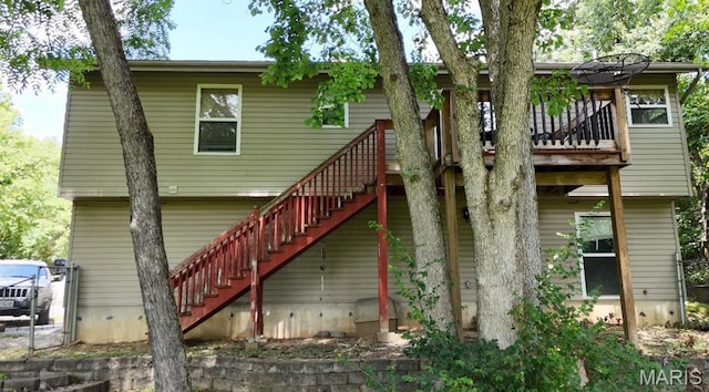 176 Briarwood Ter, De Soto, MO 63020 - rear view of property featuring stairway and a wooden deck