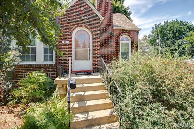 301 E 7th St, Alton, IL 62002 - entrance to property with brick siding, a chimney, and roof with shingles