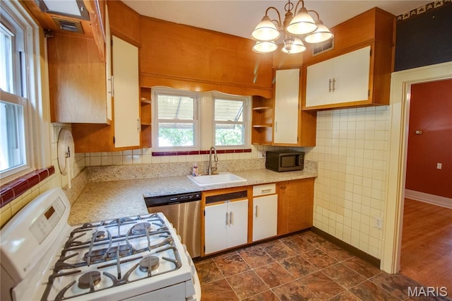 301 E 7th St, Alton, IL 62002 - kitchen featuring white range with gas cooktop, open shelves, stainless steel dishwasher, black microwave, and a chandelier