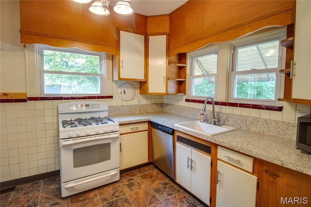 301 E 7th St, Alton, IL 62002 - kitchen featuring stainless steel appliances, light countertops, open shelves, white cabinets, and tile walls