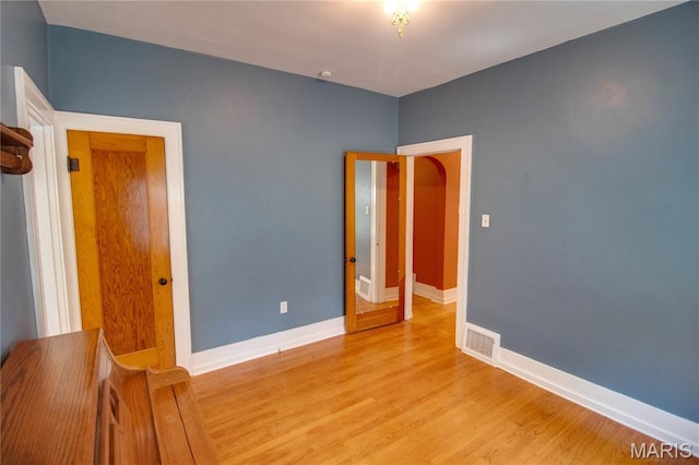 301 E 7th St, Alton, IL 62002 - empty room with light wood-style floors and baseboards