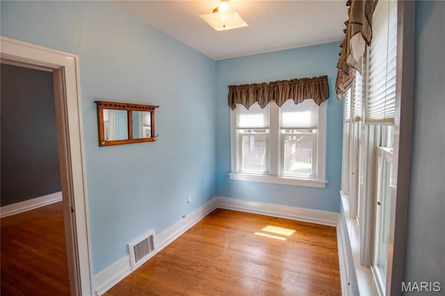 301 E 7th St, Alton, IL 62002 - spare room featuring wood finished floors