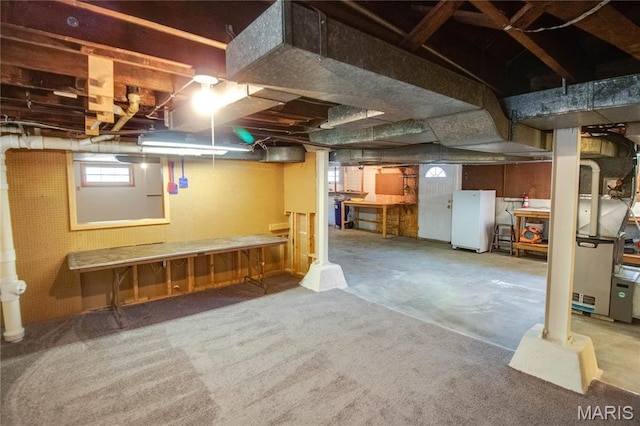 301 E 7th St, Alton, IL 62002 - basement with freestanding refrigerator and heating unit