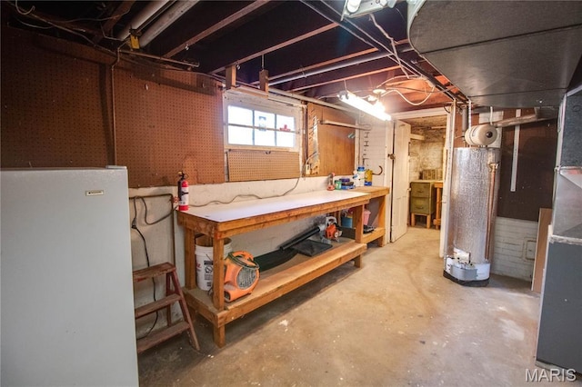 301 E 7th St, Alton, IL 62002 - below grade area with a workshop area, freestanding refrigerator, and water heater
