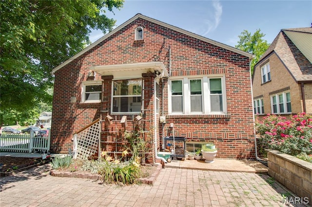 301 E 7th St, Alton, IL 62002 - view of front of property with brick siding and a patio area