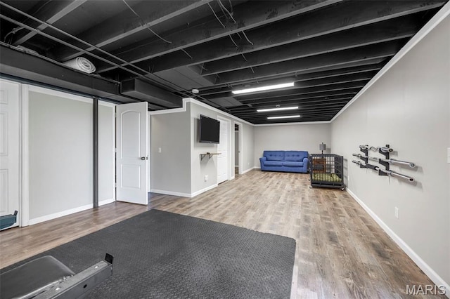 33 Kingspointe Dr, Saint Peters, MO 63376 - finished basement with wood finished floors and baseboards