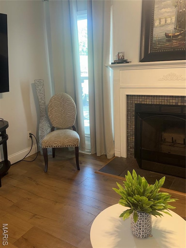 24 Lantern Ln, Lake St Louis, MO 63367 - sitting room featuring wood finished floors and a tiled fireplace