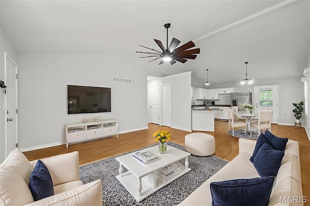 5265 Country Club Rd, Washington, MO 63090 - living area with ceiling fan, vaulted ceiling, and light wood-type flooring