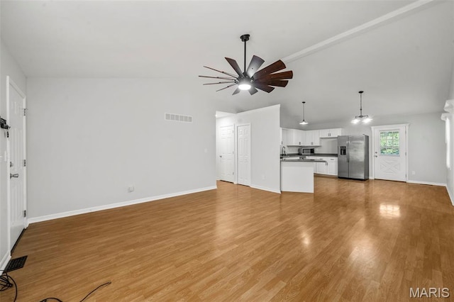 5265 Country Club Rd, Washington, MO 63090 - unfurnished living room featuring ceiling fan, vaulted ceiling, and light wood-style floors