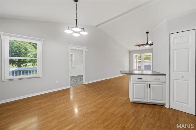5265 Country Club Rd, Washington, MO 63090 - unfurnished living room with light wood-style flooring, a ceiling fan, and a chandelier