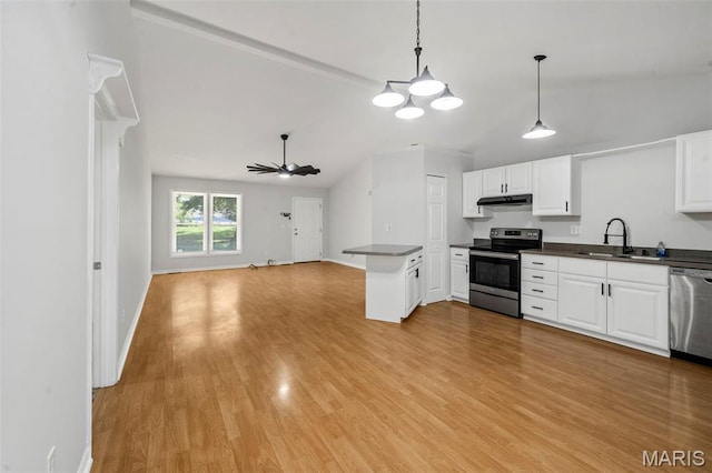 5265 Country Club Rd, Washington, MO 63090 - kitchen featuring stainless steel appliances, vaulted ceiling, dark countertops, open floor plan, and under cabinet range hood
