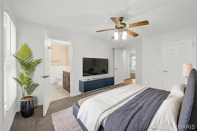 5265 Country Club Rd, Washington, MO 63090 - bedroom with light colored carpet, ensuite bath, and ceiling fan