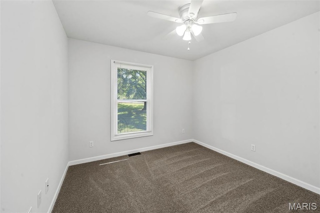 5265 Country Club Rd, Washington, MO 63090 - spare room with dark colored carpet and ceiling fan