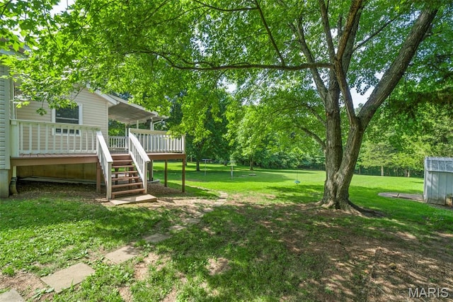 5265 Country Club Rd, Washington, MO 63090 - view of grassy yard with a wooden deck, stairway, and view of wooded area