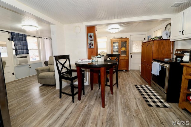 980 Laura Hufferd Rd, Roach, MO 65787 - dining space with light wood-style floors and cooling unit