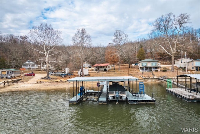 980 Laura Hufferd Rd, Roach, MO 65787 - dock area with boat lift, a water view, and view of wooded area