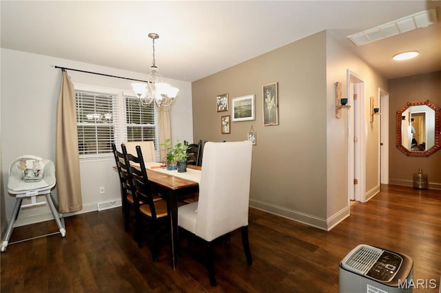 110 S Bend Rd, Lebanon, MO 65536 - dining space featuring a chandelier and dark wood finished floors