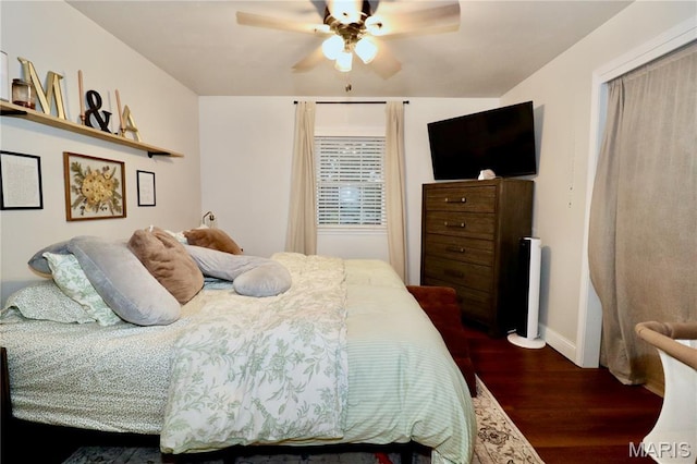 110 S Bend Rd, Lebanon, MO 65536 - bedroom with dark wood-style floors and ceiling fan