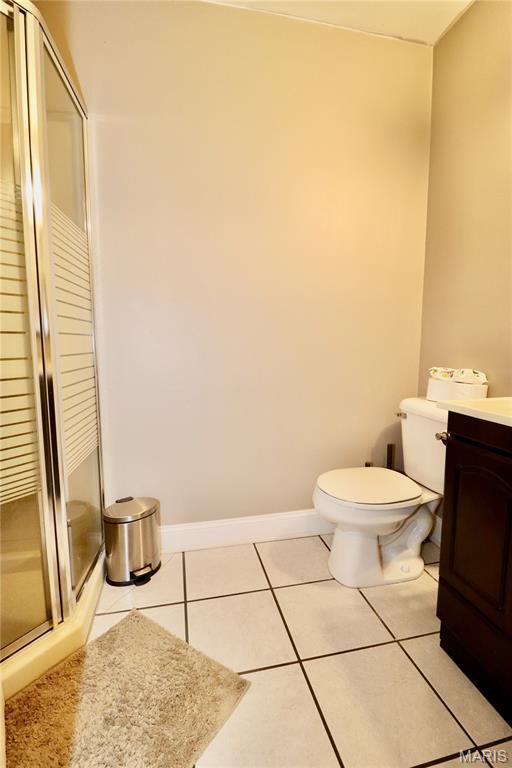 110 S Bend Rd, Lebanon, MO 65536 - full bath featuring a shower stall, vanity, and tile patterned floors