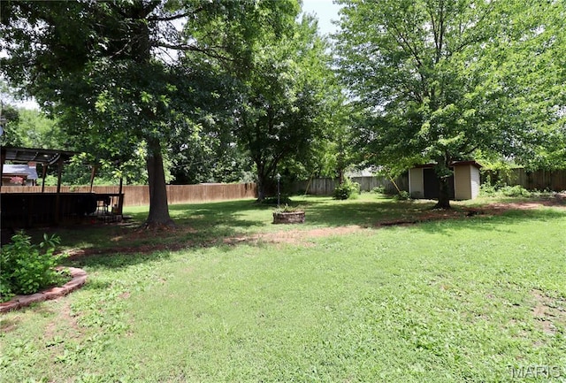 110 S Bend Rd, Lebanon, MO 65536 - fenced backyard featuring a storage unit
