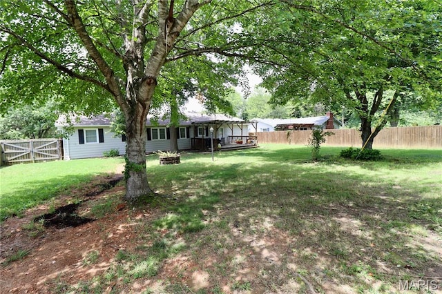 110 S Bend Rd, Lebanon, MO 65536 - fenced backyard featuring a fire pit