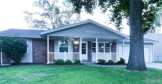19 Saint David Dr, Saint Peters, MO 63376 - ranch-style home with covered porch, a front lawn, a garage, driveway, and brick siding