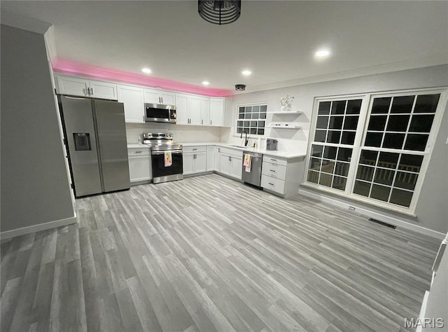 19 Saint David Dr, Saint Peters, MO 63376 - kitchen featuring stainless steel appliances, light countertops, light wood-style floors, open shelves, and recessed lighting