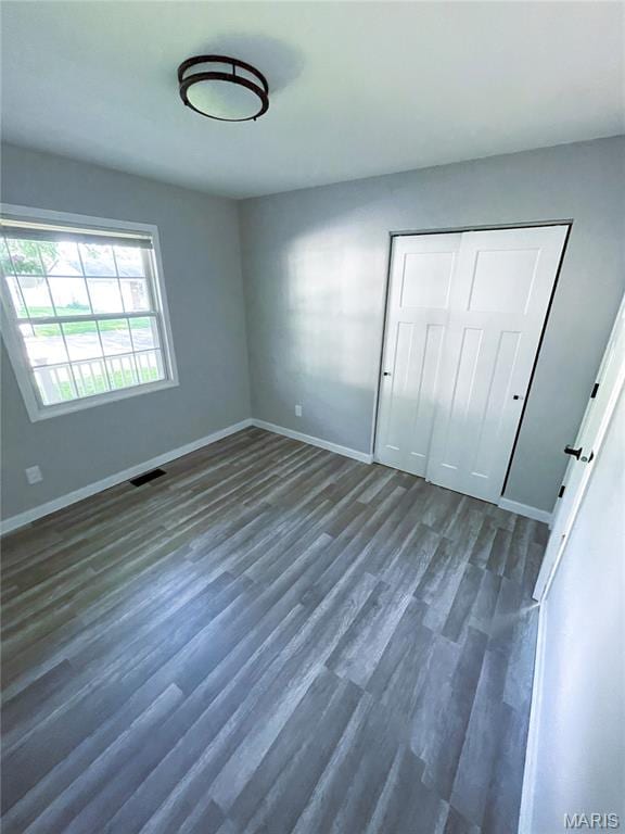 19 Saint David Dr, Saint Peters, MO 63376 - unfurnished bedroom featuring dark wood finished floors and a closet