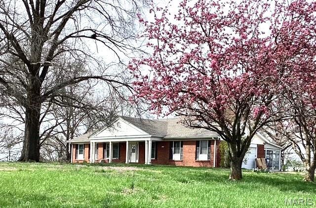 1897 Indian Trail Rd, Pacific, MO 63069 - single story home featuring a front yard and brick siding