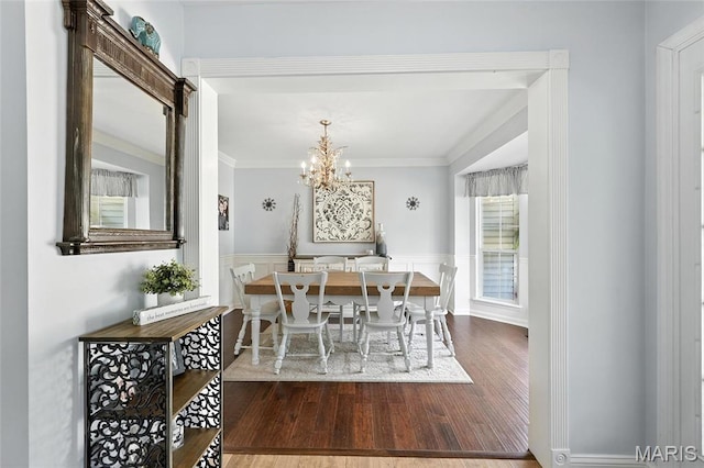 2039 Meramec Meadows Dr, Fenton, MO 63026 - dining space featuring wood finished floors, ornamental molding, a chandelier, and wainscoting