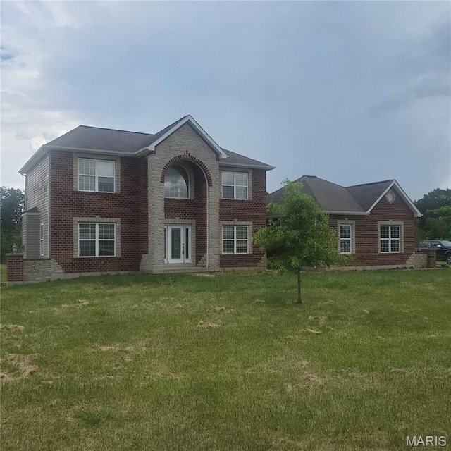 13801 Country Meadow Ct, Wright City, MO 63390 - traditional home with a front yard and brick siding